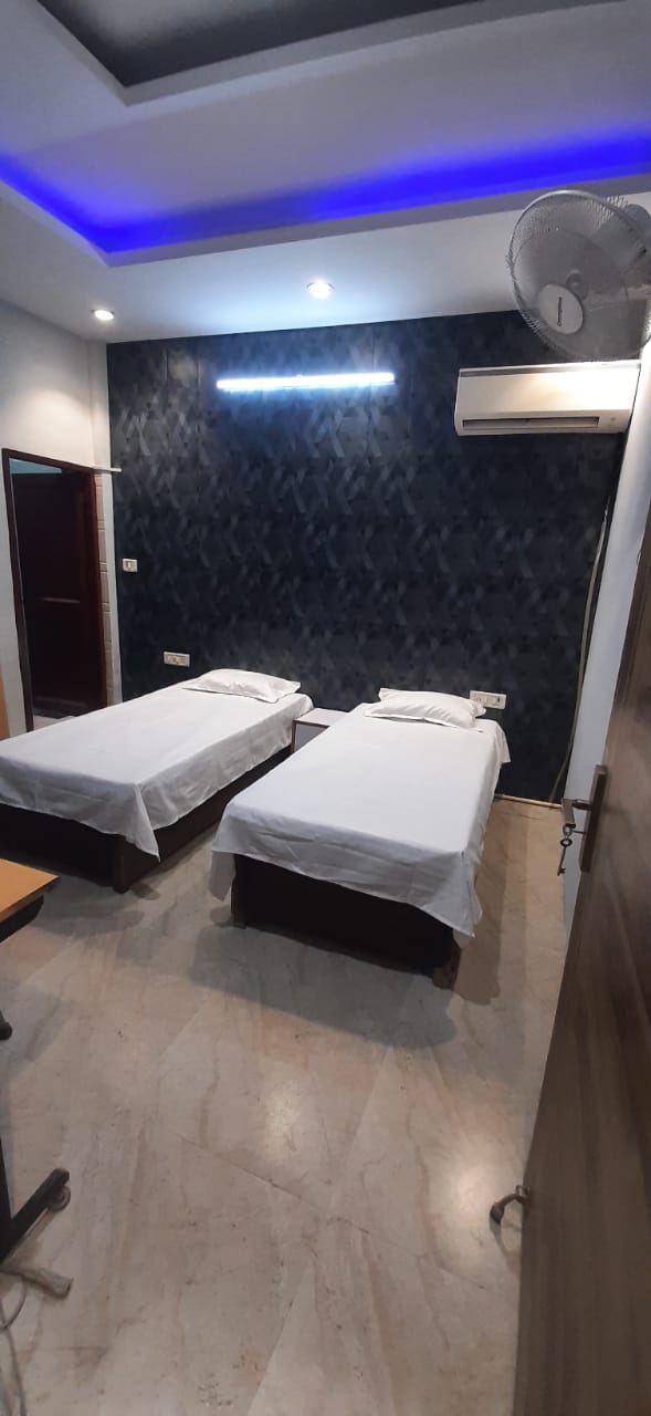 Twin bedroom in top rated boys PG Laxmi Nagar